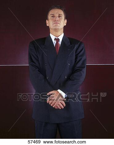 Stock Photo - Portrait of businessman looking confident . Fotosearch