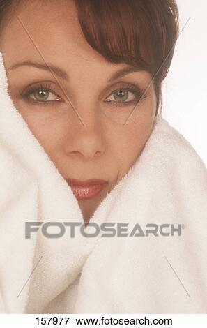 Stock Photo - Portrait of mid adult woman with towel . Fotosearch