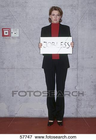 Portrait of young woman looking frustrated and holding jobless signboard View Large Photo Image Stock Photo - Portrait of young woman looking frustrated and holding jobless signboard . Fotosearch
