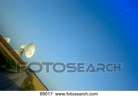 Radio telescope dish in field View Large Photo Image Stock Photo - Radio telescope dish in field . Fotosearch