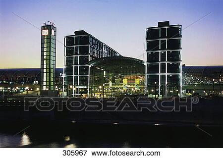 Railway station lit up at dusk, Spree River, New Central Station, Berlin Hauptbahnhof, Berlin, Germany View Large Photo Image Stock Photo - Railway station lit up at dusk, Spree River, New Central Station, Berlin Hauptbahnhof, Berlin, Germany . Fotosearch