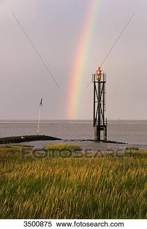 Rainbow above the North Sea at Fedderwardersiel, Germany View Large Photo Image Stock Photography - Rainbow above the North Sea at Fedderwardersiel, Germany . Fotosearch