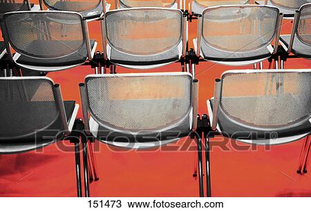 Rear view of empty chairs in rows View Large Photo Image Stock Image - Rear view of empty chairs in rows . Fotosearch