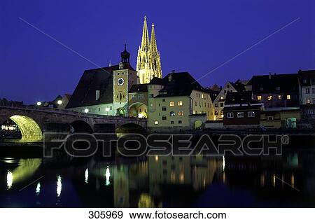 Reflection of bridge and church in water, Regensburg, Bavaria, Germany View Large Photo Image Stock Photo - Reflection of bridge and church in water, Regensburg, Bavaria, Germany . Fotosearch