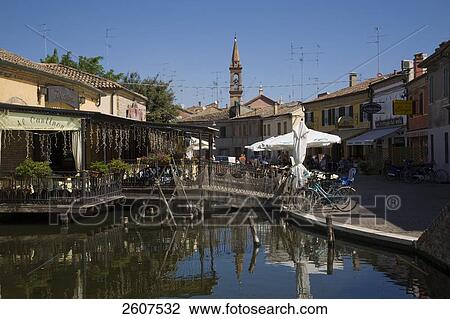 Reflection of buildings in canal, Comacchio, Emilia-Romagna, Italy View Large Photo Image Stock Image - Reflection of buildings in canal, Comacchio, Emilia-Romagna, Italy . Fotosearch