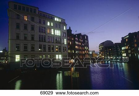 Reflection of buildings in canal, Hamburg, Germany View Large Photo Image Stock Photo - Reflection of buildings in canal, Hamburg, Germany . Fotosearch