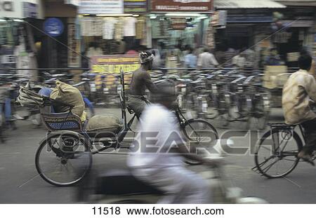 Rickshaw driver carrying goods in cart, Pondicherry, India View Large Photo Image Stock Photo - Rickshaw driver carrying goods in cart, Pondicherry, India . Fotosearch