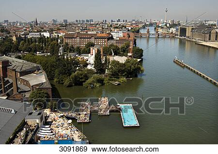 River Spree with the bathing ship, Oberbaumbruecke and skyline of Berlin Mitte, Berlin, Germany View Large Photo Image Stock Photo - River Spree with the bathing ship, Oberbaumbruecke and skyline of Berlin Mitte, Berlin, Germany . Fotosearch