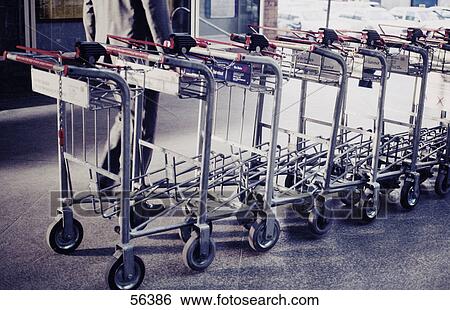 Row of luggage carts at airport View Large Photo Image Stock Photograph - Row of luggage carts at airport . Fotosearch