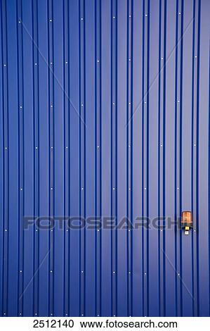 Safety alarm on blue wall of storehouse View Large Photo Image Stock Image - Safety alarm on blue wall of storehouse . Fotosearch
