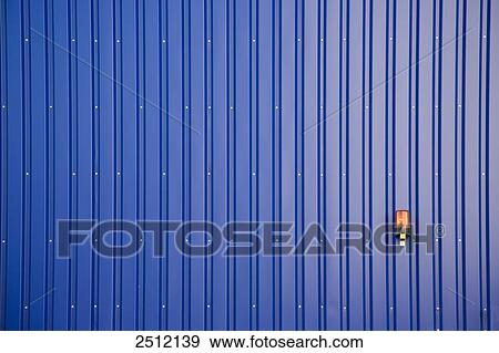 Safety alarm on blue wall of storehouse View Large Photo Image Stock Photo - Safety alarm on blue wall of storehouse . Fotosearch