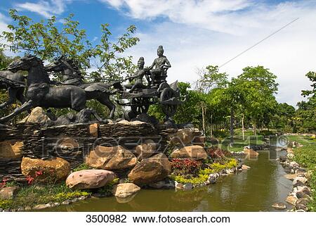 Stock Image - Sculpture of Aditya, open air museum Ancient City, Thailand . Fotosearch