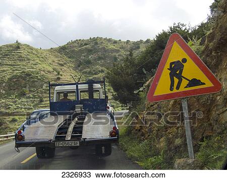 Semi-truck in motion near construction road sign, La Gomera, Canary Islands, Spain View Large Photo Image Stock Image - Semi-truck in motion near construction road sign, La Gomera, Canary Islands, Spain . Fotosearch