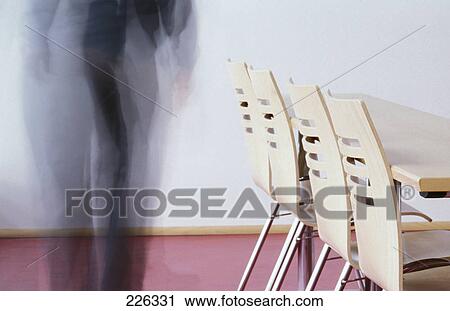 Stock Image - Side profile of empty chairs . Fotosearch