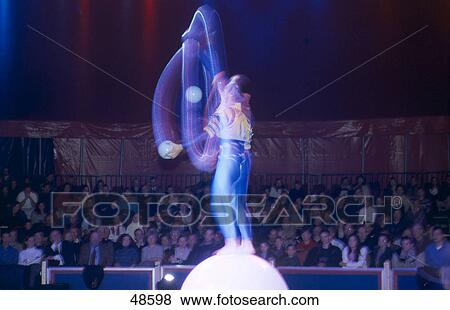 Side profile of juggler performing in circus ring View Large Photo Image Stock Photo - Side profile of juggler performing in circus ring . Fotosearch