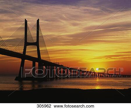 Silhouette of bridge across river, Vasco da Gama Bridge, Tejo River, Lisbon, Portugal View Large Photo Image Stock Image - Silhouette of bridge across river, Vasco da Gama Bridge, Tejo River, Lisbon, Portugal . Fotosearch