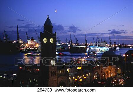 Stock Photo - Silhouette of clock tower at port, St. Pauli Landungsbrucken, Hamburg, Germany . Fotosearch