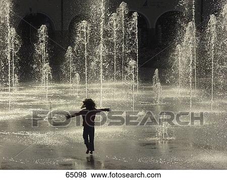 Silhouette of girl playing in fountain  View Large Photo Image Stock Photo - Silhouette of girl playing in fountain . Fotosearch