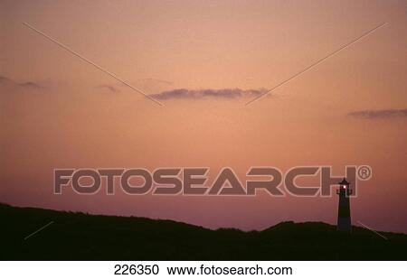 Silhouette of lighthouse at dusk View Large Photo Image Stock Image - Silhouette of lighthouse at dusk . Fotosearch