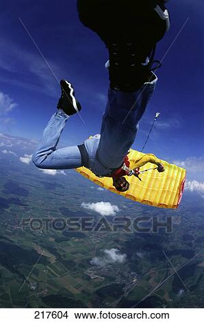 Picture - Skydiver falling towards ground . Fotosearch