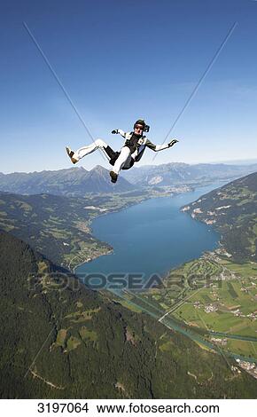 Picture - Skydiver free-falling, Interlaken, Switzerland . Fotosearch