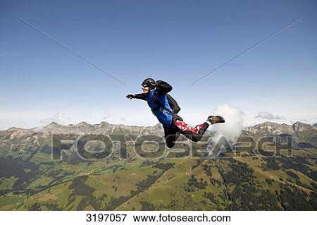 Stock Photo - Skydiver free-falling, Saanen, Switzerland . Fotosearch