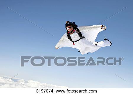 Skydiver with wingsuit, Reichenbach, Bern, Switzerland View Large Photo Image Picture - Skydiver with wingsuit, Reichenbach, Bern, Switzerland . Fotosearch