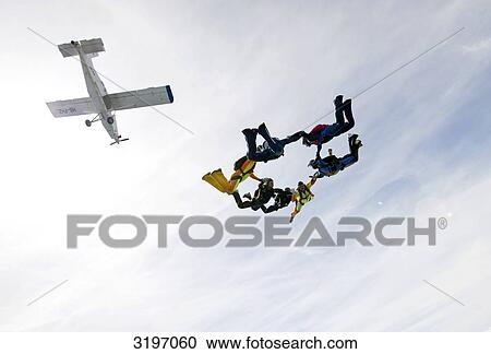 Skydivers falling in formation, Saanen, Switzerland View Large Photo Image Stock Image - Skydivers falling in formation, Saanen, Switzerland . Fotosearch