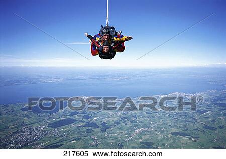 Skydivers falling towards ground View Large Photo Image Stock Photography - Skydivers falling towards ground . Fotosearch