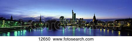 Stock Image - Skylines at waterfront, Main, Frankfurt, Hesse, Germany . Fotosearch