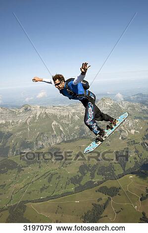 Stock Photo - Skysurfer, Saanen, Switzerland, side view . Fotosearch
