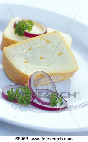 Slices of cheese and rings of onions with parsley on plate View Large Photo Image Stock Photo - Slices of cheese and rings of onions with parsley on plate . Fotosearch