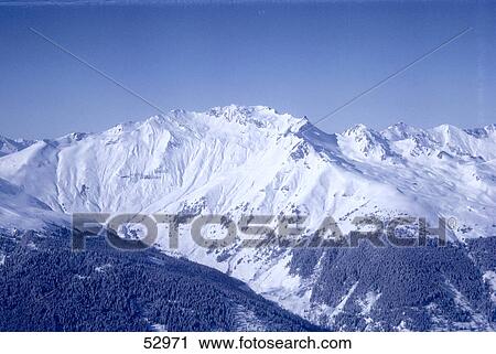 Snow covered mountains in winter, Switzerland View Large Photo Image Stock Image - Snow covered mountains in winter, Switzerland . Fotosearch