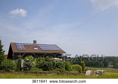 Stock Image - Solar panels on the roof of a detached house, Schoemberg, Baden-Wuerttemberg, Germany . Fotosearch