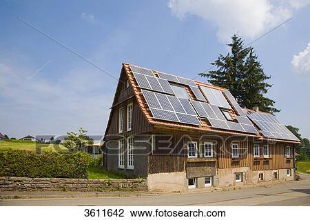 Stock Image - Solar panels on the roof of a house, Schoemberg, Baden-Wuerttemberg, Germany . Fotosearch