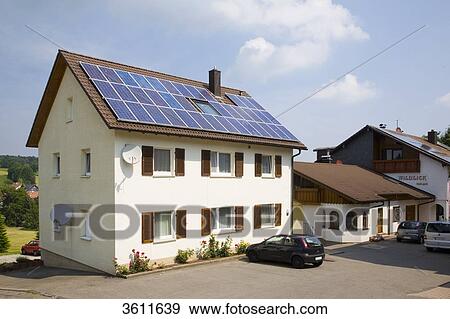 Stock Photo - Solar panels on the roof of an apartment building, Schoemberg, Baden-Wuerttemberg, Germany . Fotosearch