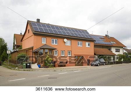 Stock Photograph - Solar panels on the roof of two detached houses, Schoemberg, Baden-Wuerttemberg, Germany . Fotosearch