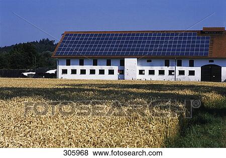 Solar panels on top of building on landscape View Large Photo Image Stock Photo - Solar panels on top of building on landscape . Fotosearch