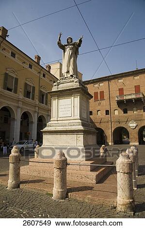 Stock Photo - Statue on pedestal in front of palace, Savonarola Monument, Ferrara, Emilia-Romagna, Italy . Fotosearch