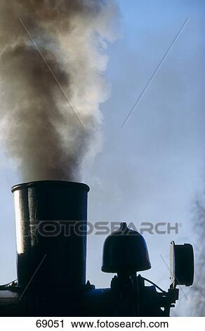 Stock Image - Steam engine emitting smoke . Fotosearch