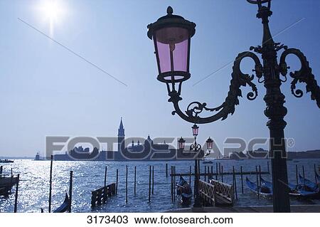 Street lamp at waterside promenade, Venice, Italy, silhouette View Large Photo Image Stock Image - Street lamp at waterside promenade, Venice, Italy, silhouette . Fotosearch