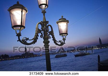 Street lamp at waterside promenade, Venice, Italy, slanted view View Large Photo Image Stock Photo - Street lamp at waterside promenade, Venice, Italy, slanted view . Fotosearch