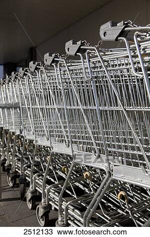 Supermarket shopping trolleys in row View Large Photo Image Stock Image - Supermarket shopping trolleys in row . Fotosearch