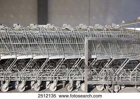 Supermarket shopping trolleys in row View Large Photo Image Stock Photography - Supermarket shopping trolleys in row . Fotosearch