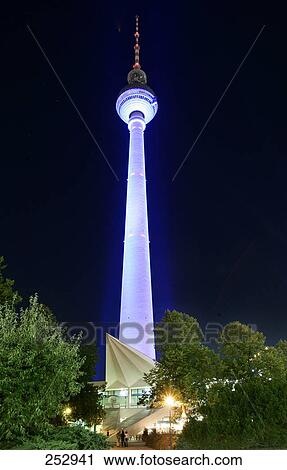 Stock Image - Television tower lit up at night, Alexanderplatz, Berlin, Germany . Fotosearch