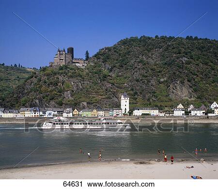 Stock Image - Tour boat in river, Castle Katz, River Rhine, Rheingau, St. Goarshausen, Rhineland-Palatinate, Germany . Fotosearch