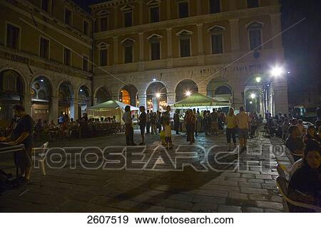 Stock Photo - Tourists at cafe during night, Campo Della Pescaria, Veneto, Venice, Italy . Fotosearch