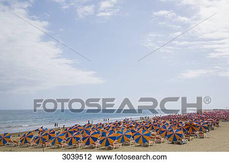 Stock Image - Tourists at the beach of Maspalomas, Gran Canaria, Canary Islands, Spain . Fotosearch