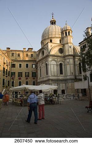 Stock Image - Tourists in front of church, Santa Maria dei Miracoli, Veneto, Venice, Italy . Fotosearch