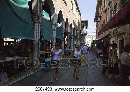 Stock Image - Tourists in street, Rialto Market, Veneto, Venice, Italy . Fotosearch